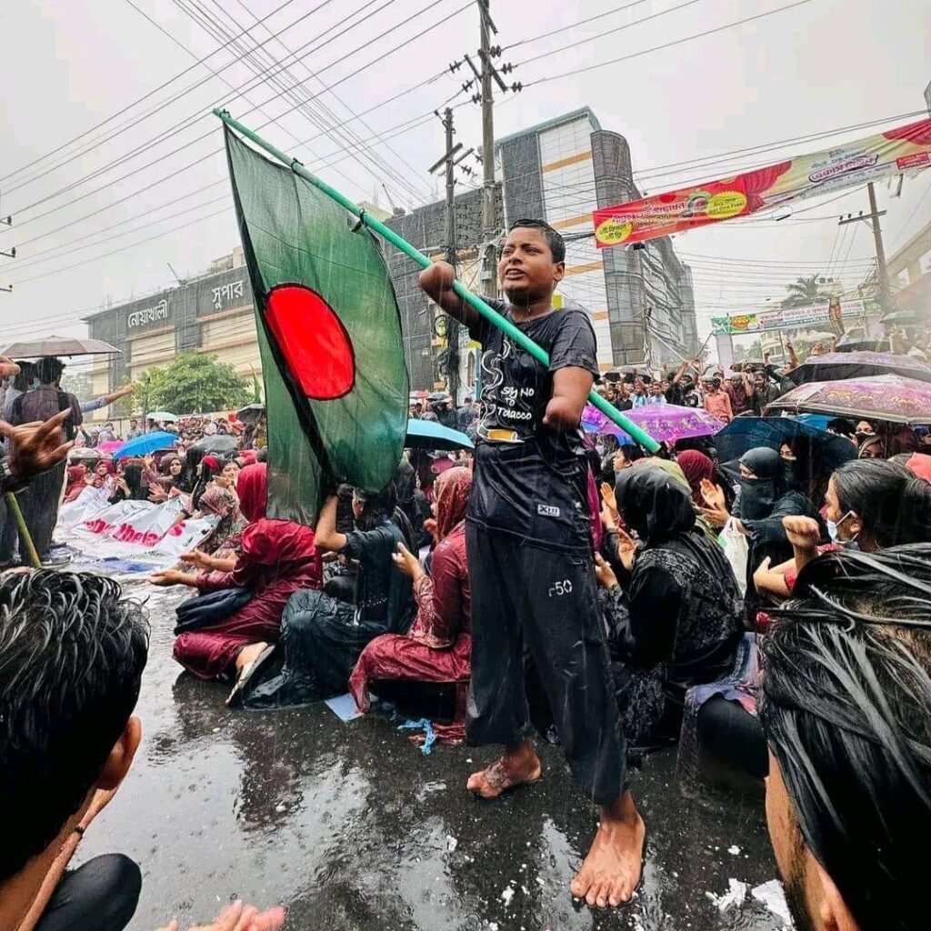 A disabled child protesting with BD flag